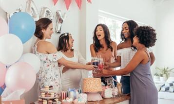 Image of five female friends celebrating at a baby shower