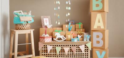 Image of baby shower presents displayed on a table and stool