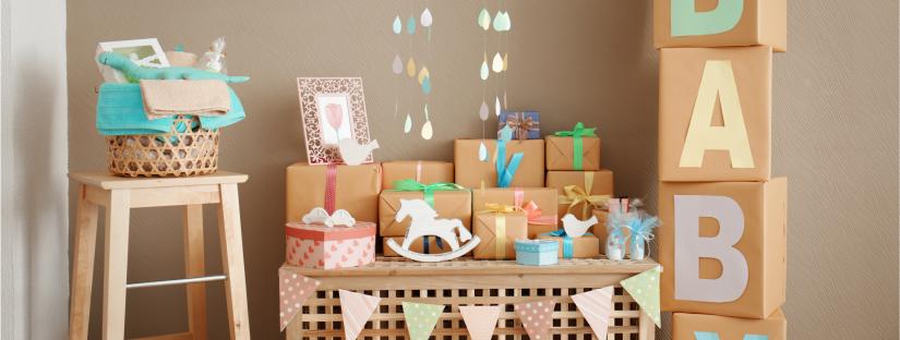 Image of baby shower presents displayed on a table and stool